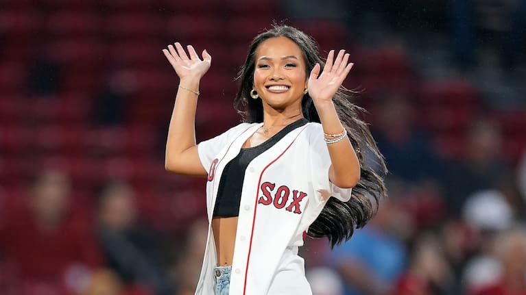 Jenn Tran waves before throwing the ceremonial first pitch prior to a baseball game between the Boston Red Sox and the Chicago White Sox