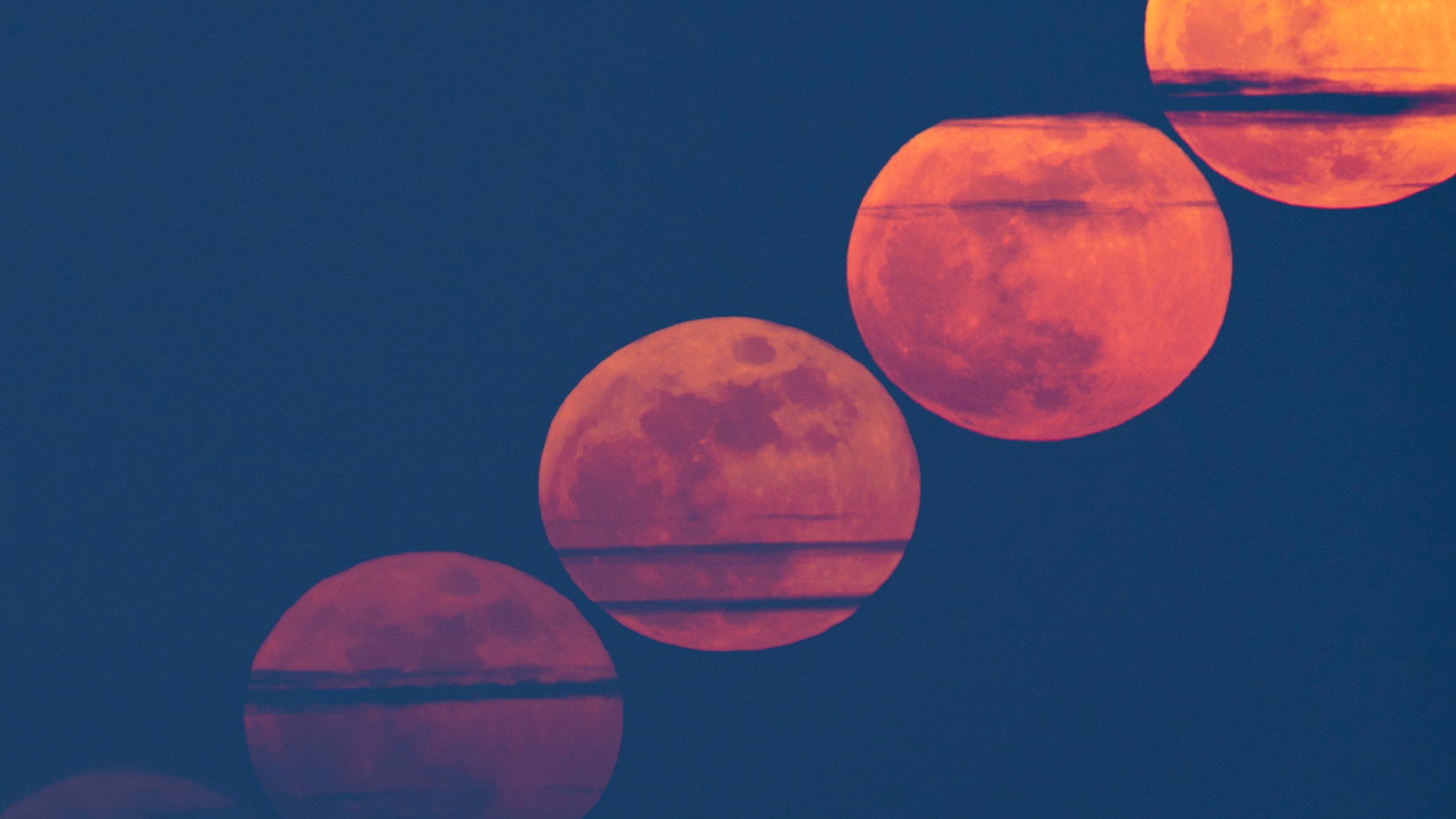 A composite view showing a diagonal line of cloud-streaked red full moons rising through a dark evening sky.