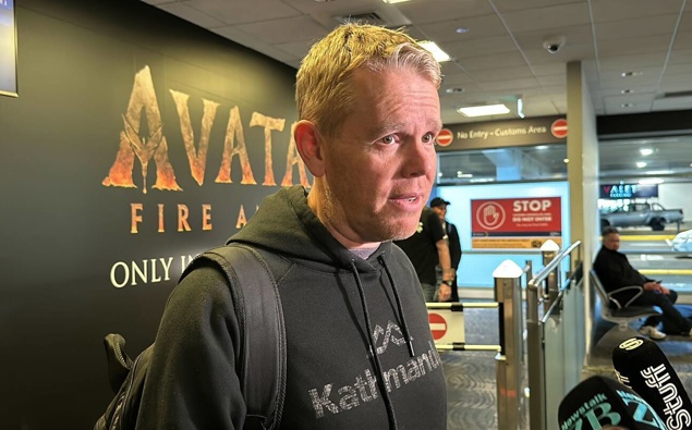 Chris Hipkins arrives back in New Zealand amid questions over ex-wife’s allegations