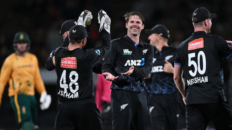 Lockie Ferguson and team mates celebrate.