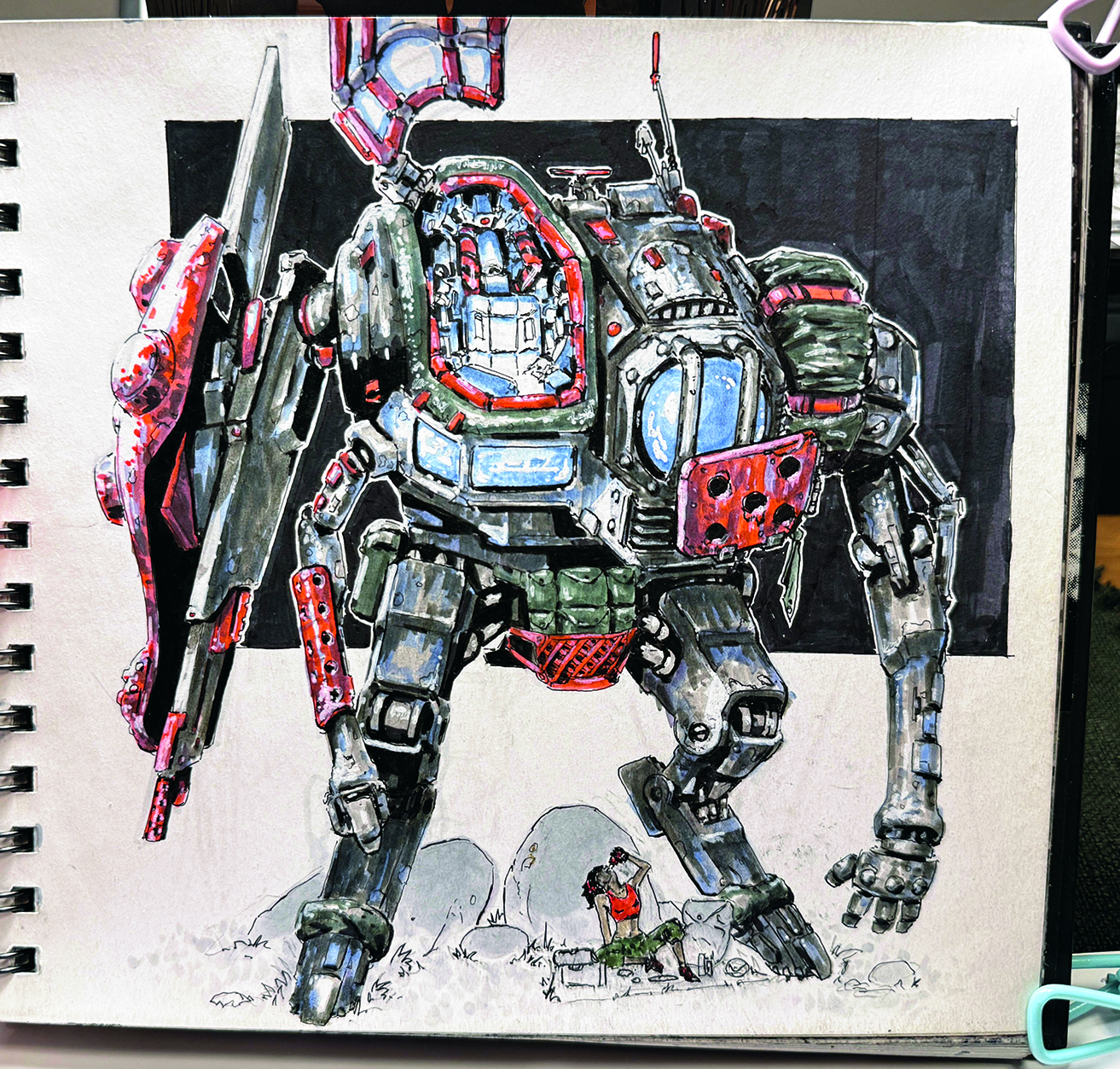 A sketchbook page showing concept art of a mech