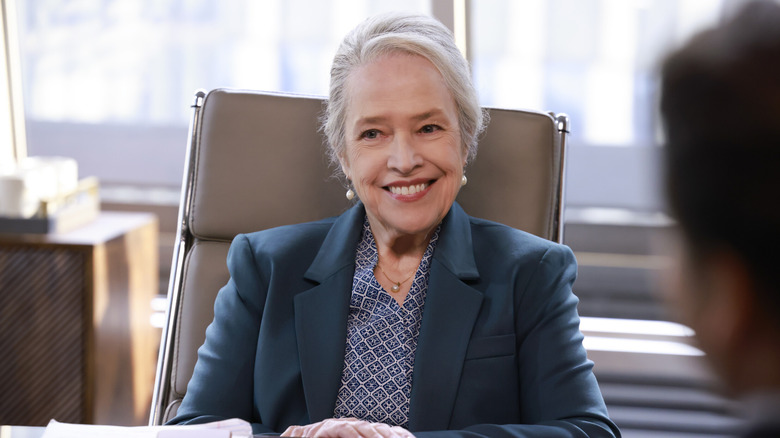 Matty Matlock (Kathy Bates) smiles while sitting in a courtroom in Matlock (2024)