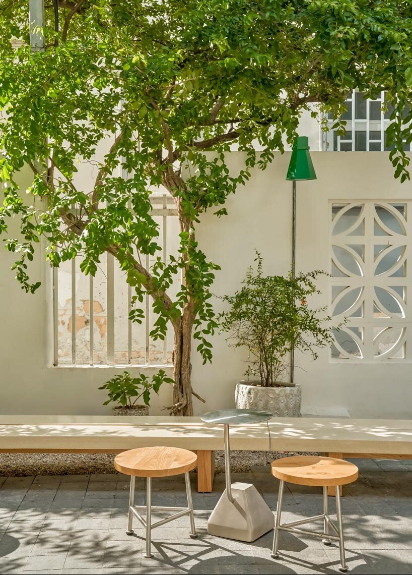 century-old courtyard villa in vietnam revives as matte teabar flagship - 4