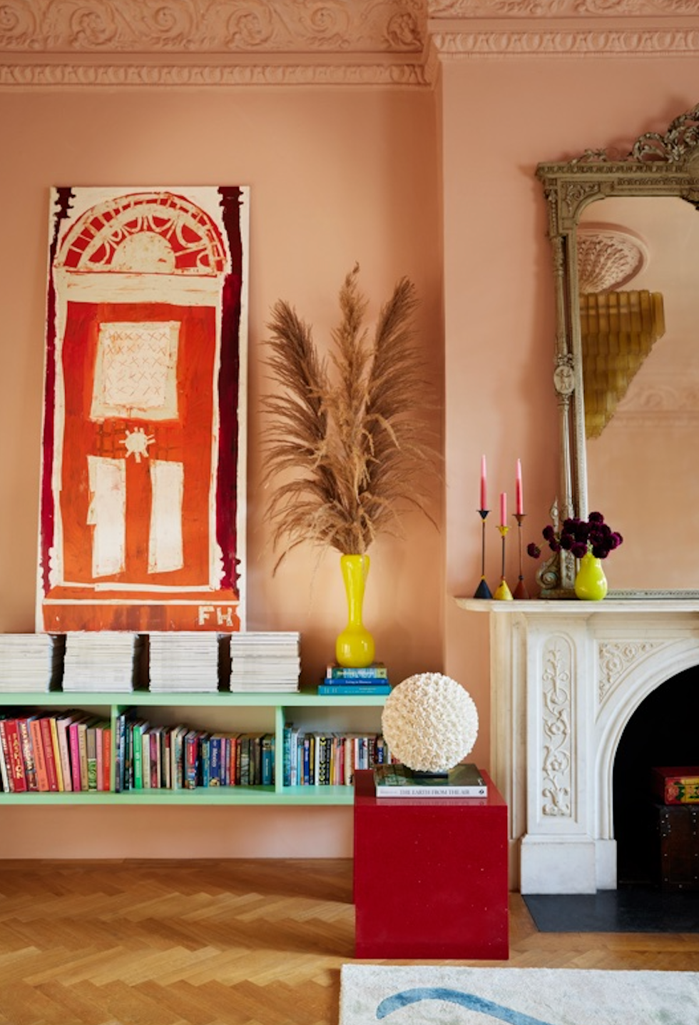 a book shelf with a vase and books on it