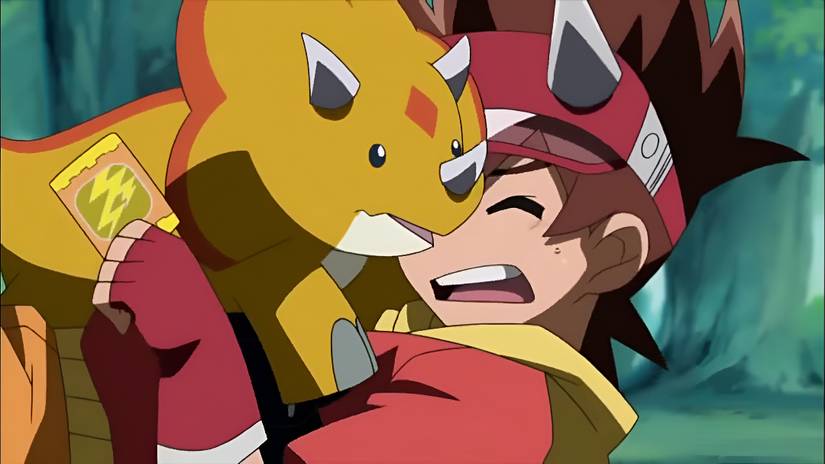 A child happily hugs his pet dinosaur in Dinosaur King