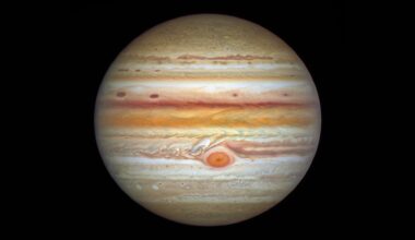 The gas giant Jupiter is pictured against a black background in an image captured by the Hubble Space Telescope. Multi-coloured cloud bands and storms are visible on its surface, as is the Great Red Spot.