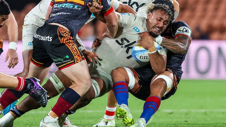 Moana Pasifika's Semisi Tupou Ta'eiloa is tackled during his team's loss to the Chiefs in round four.