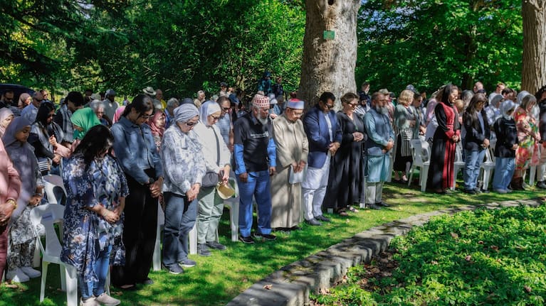 Mourners gather at the formal memorial in the Botanic Gardens to hear the names of the 51 shuhada read, with the Peace Bell tolling in remembrance of each person.