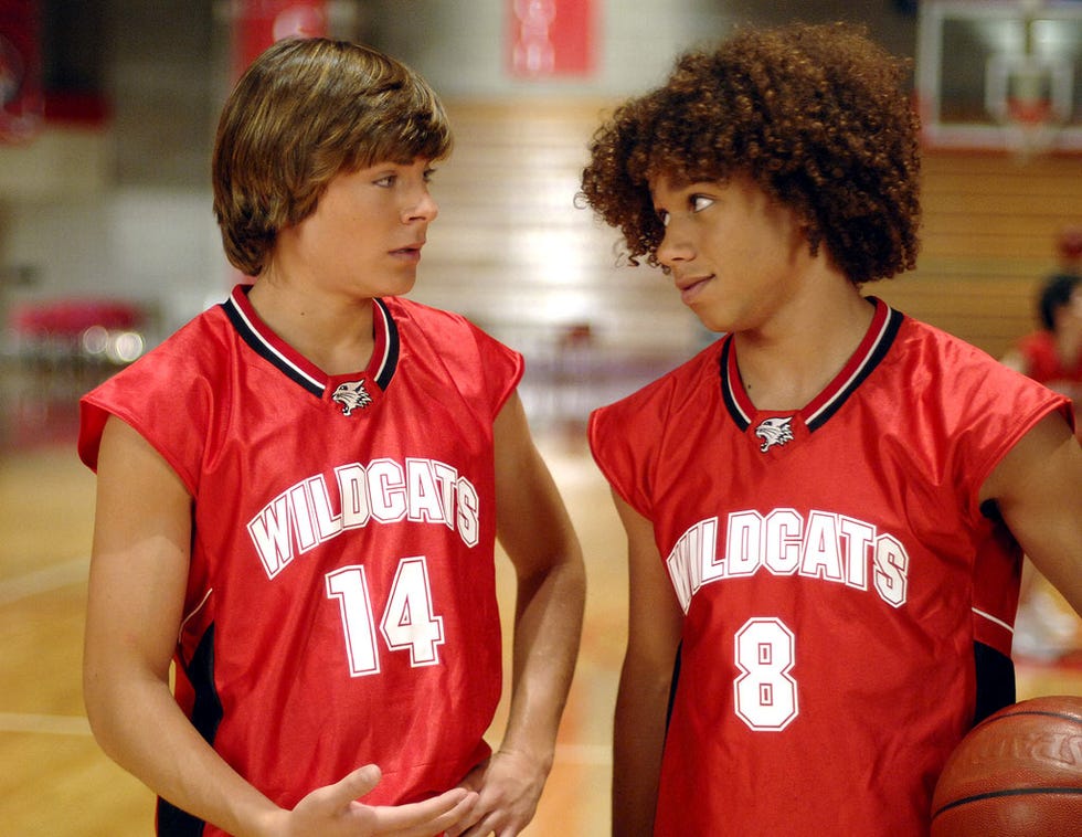 Zac Efron and Corbin Bleu in High School Musical zac efron and corbin bleu in high school musical as troy and chad, in their red basketball outfits