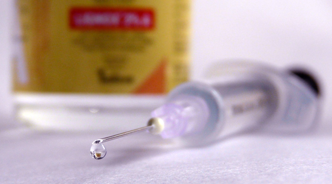 Needle with drop at the tip.