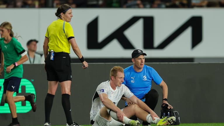 New Zealand's Francis de Vries goes off injured against Finland at Eden Park in Auckland.