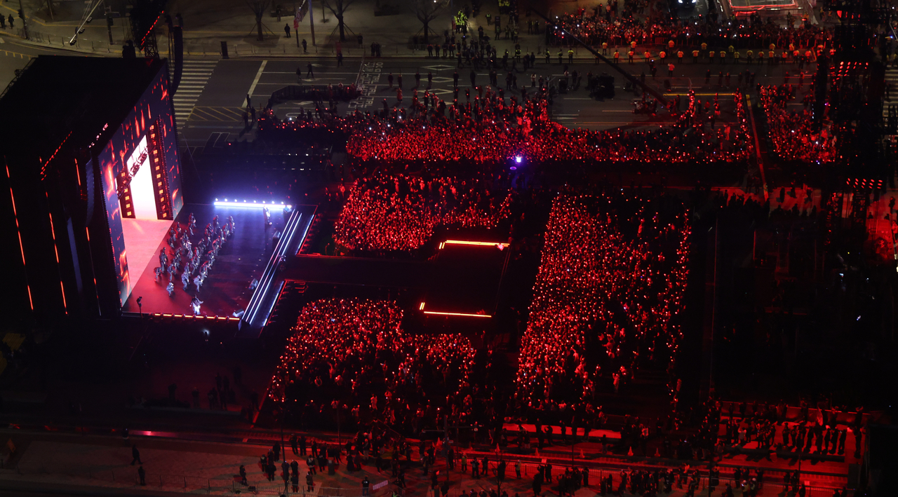 Fans fill Gwanghwamun Square as BTS perform during their comeback performance in Seoul on Saturday. (Yonhap)