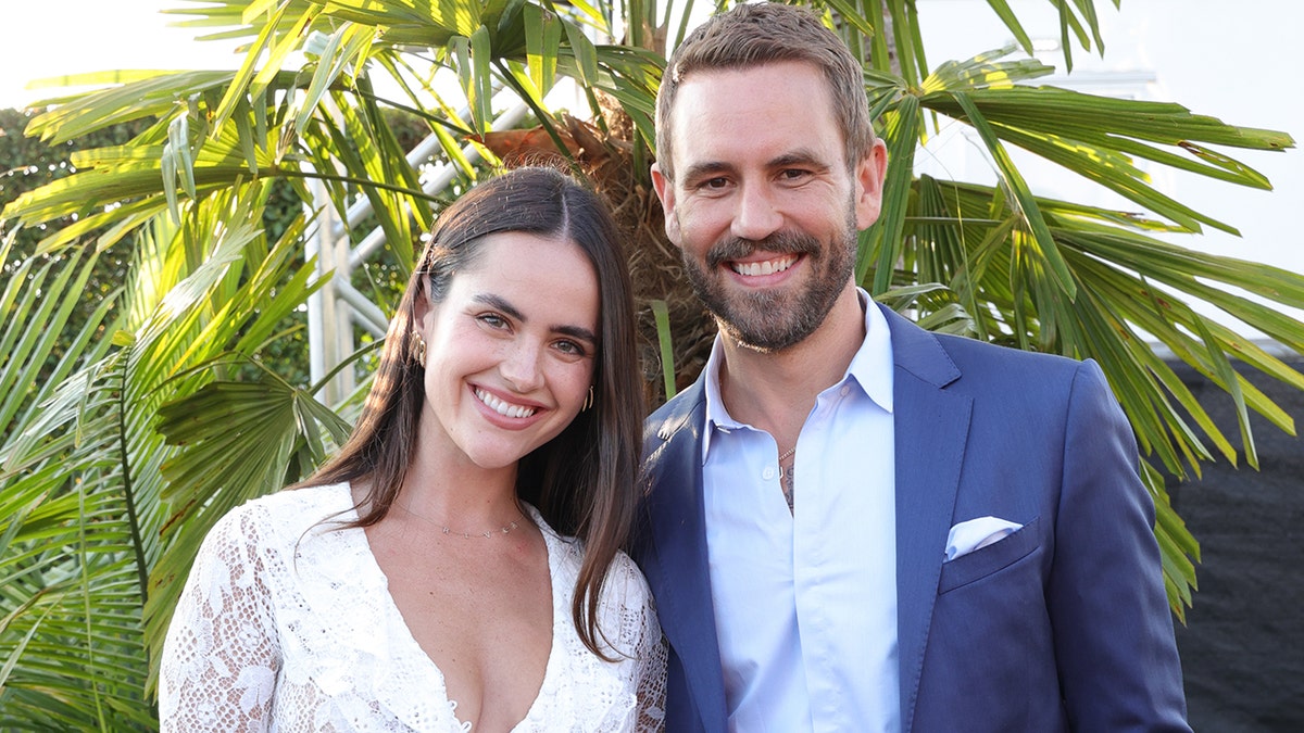 Nick Viall and Natalie Joy smiling at the camera at the Santa Monica Pier in July 2025.