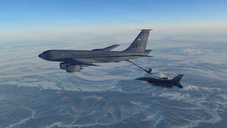 A North American Aerospace Defense Command F-16 fighter refueling from a KC-135 Stratotanker over western Alaska