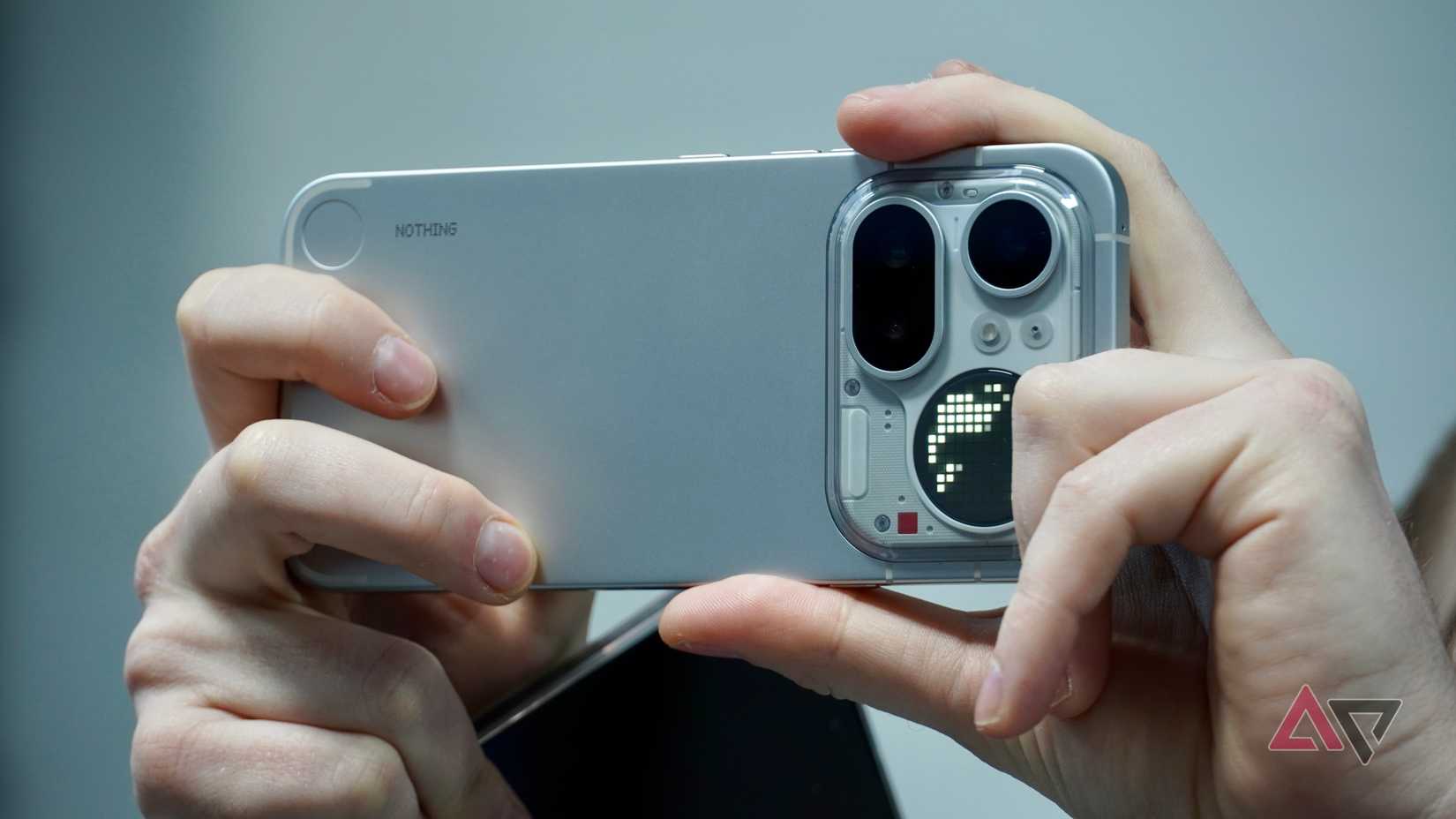 A person holding the Nothing Phone (4a) Pro