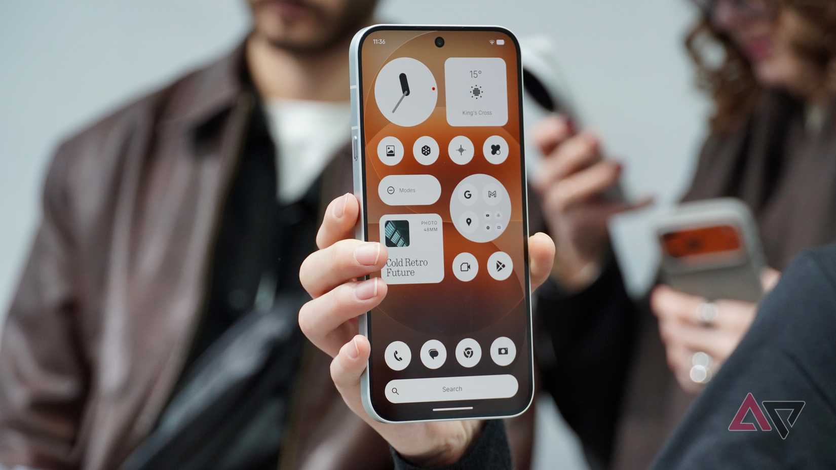 A person holding the Nothing Phone (4a) Pro