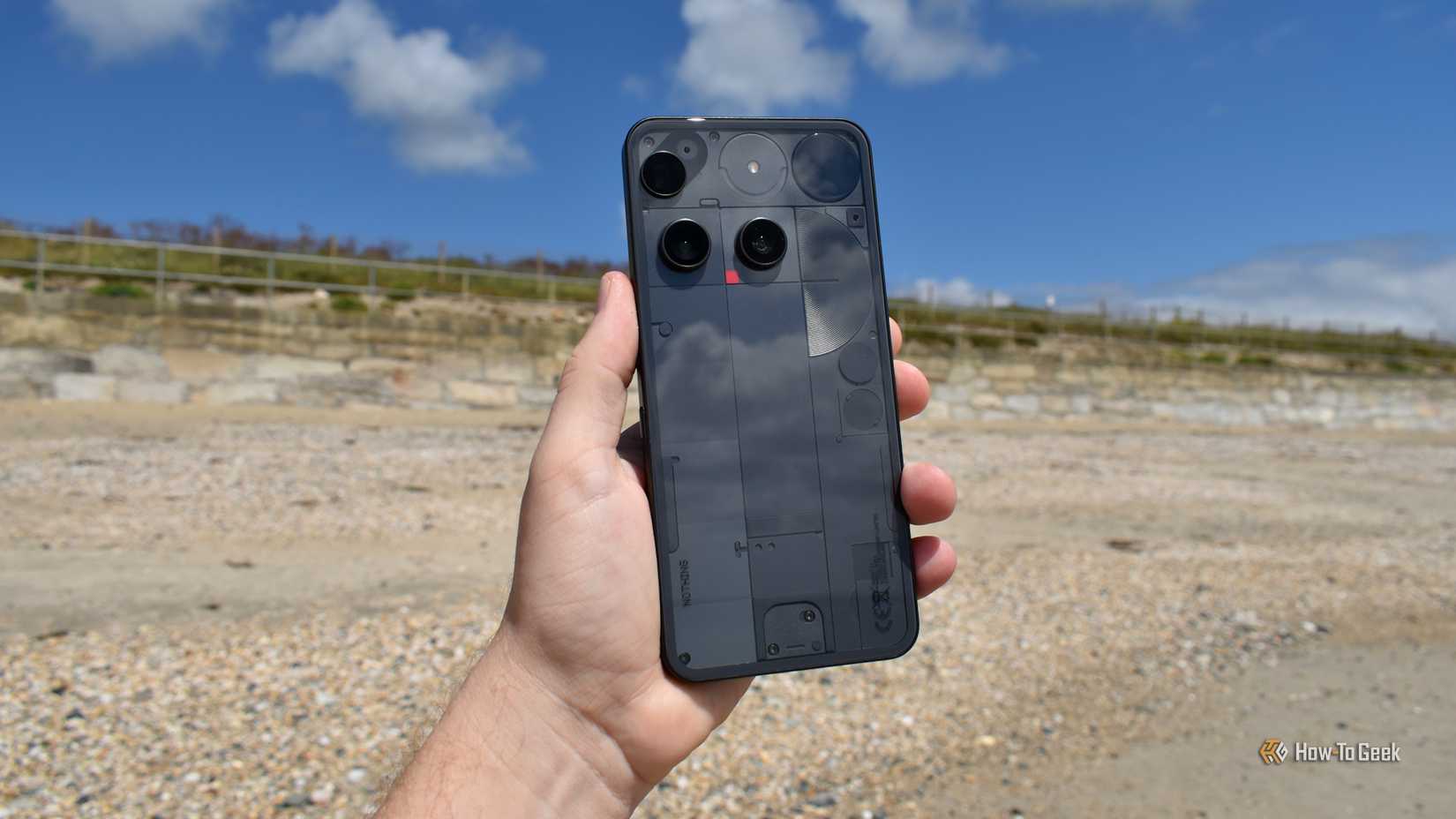 nothing phone 3 in hand on beach.