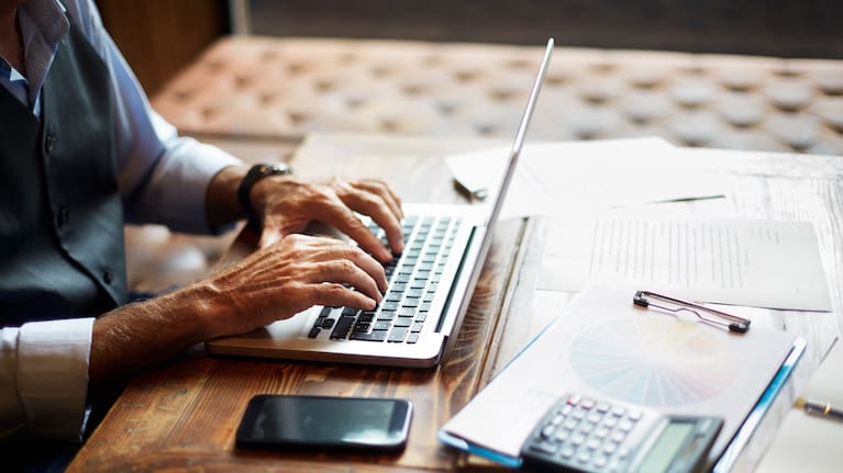 Older person working on a laptop (file photo)