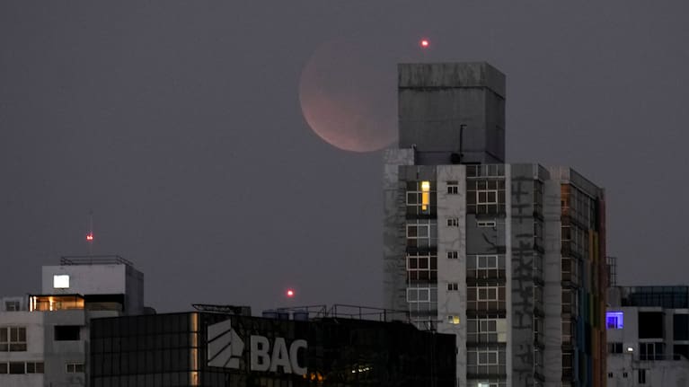 A total lunar eclipse is seen from Panama City before sunrise, Tuesday, March 3, 2026.
