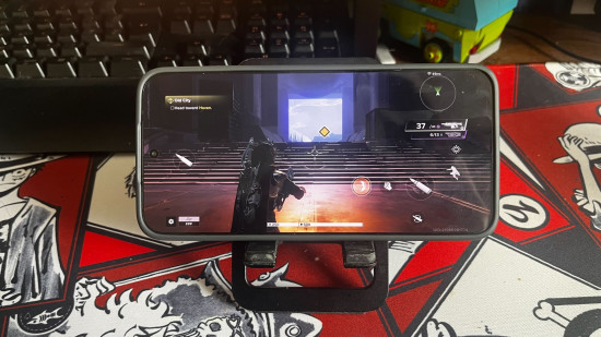 Poco X8 Pro Max review - a phone on a stand with a game playing