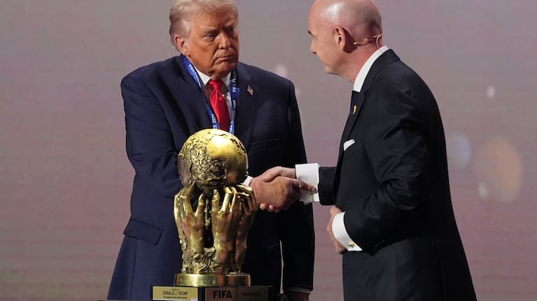 President Donald Trump receives the FIFA Peace Prize from FIFA President Gianni Infantino during the draw for the 2026 FIFA World Cup at the Kennedy Center in Washington. 