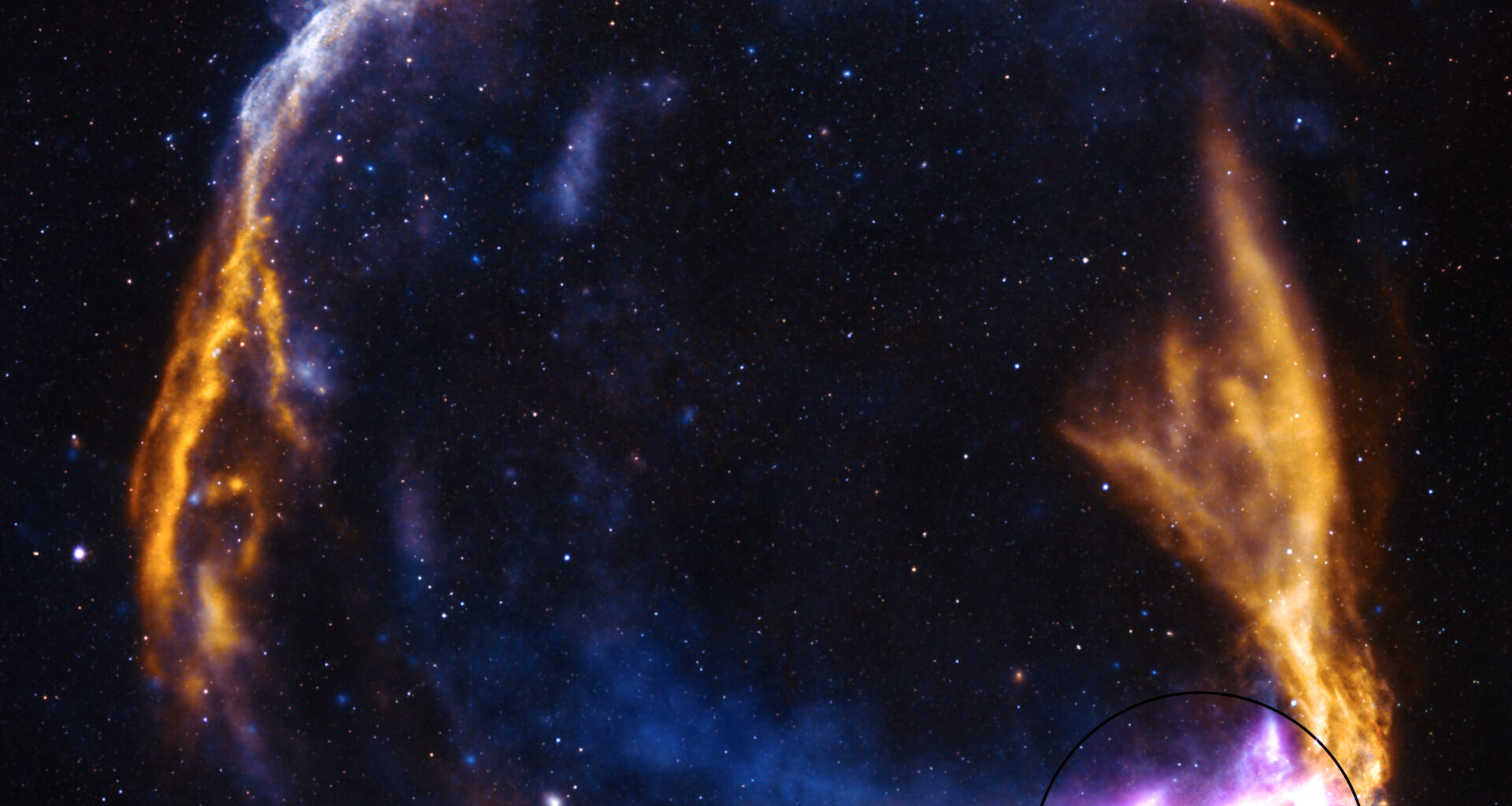A fiery orange supernova remnant has the shame of a ring breaking apart. The outer rim is highlighted in purple at bottom right. There are stars dotting the darkness of space.