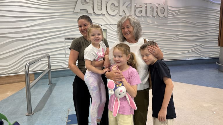 Rebecca Fleming and her family at Auckland Airport.
