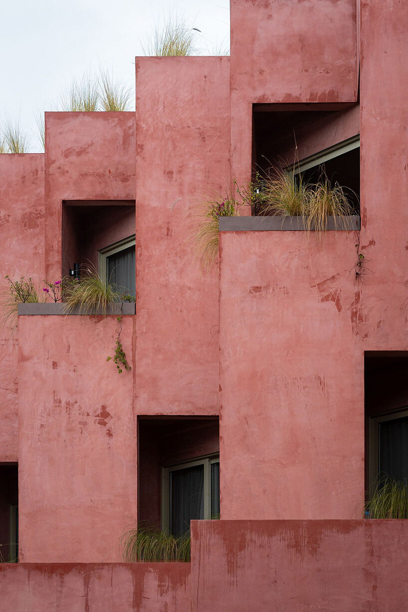 red-toned stucco surfaces form layered facade for boutique hotel by RA! in mexico - 3