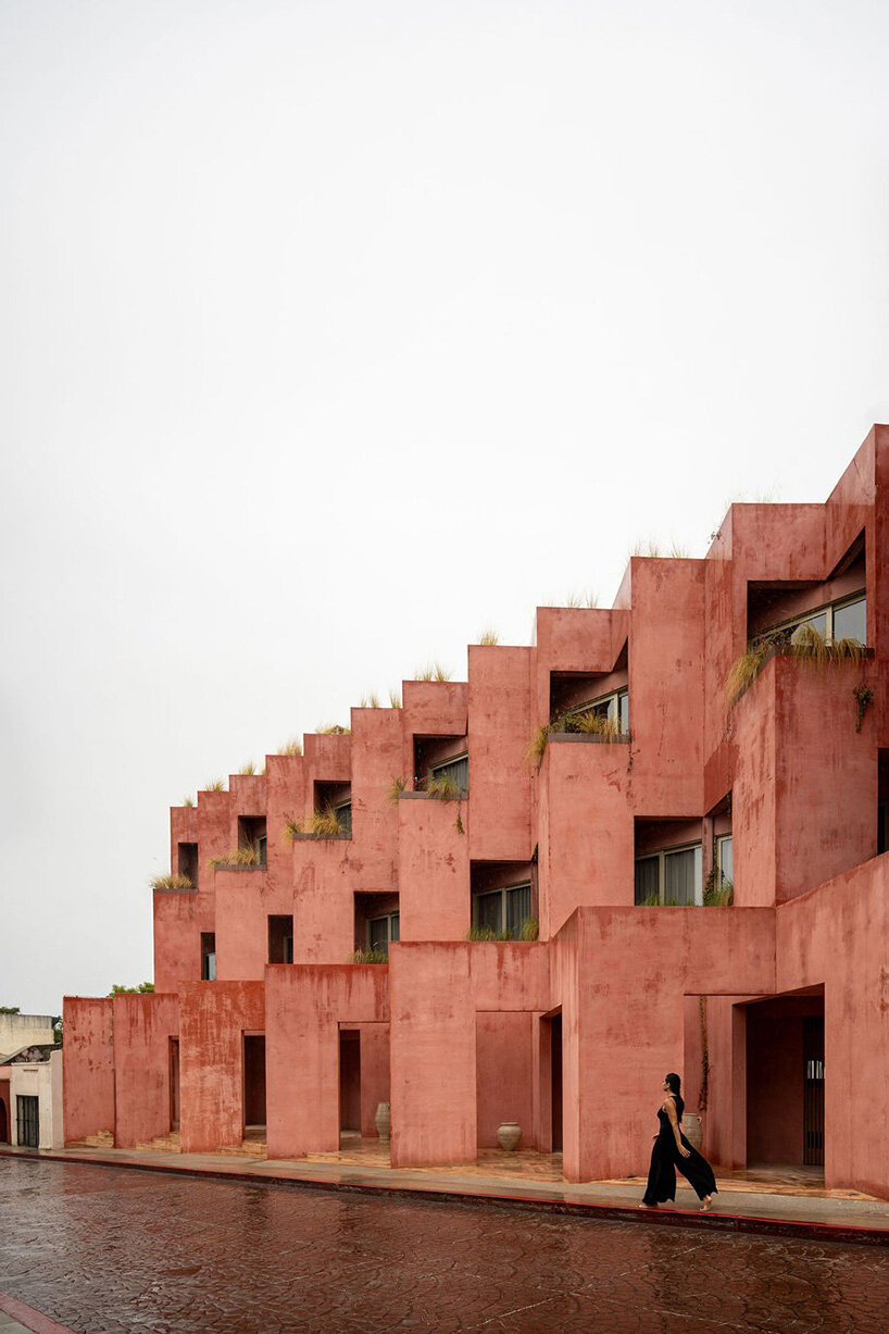 red-toned stucco surfaces form layered facade for boutique hotel by RA! in mexico - 2