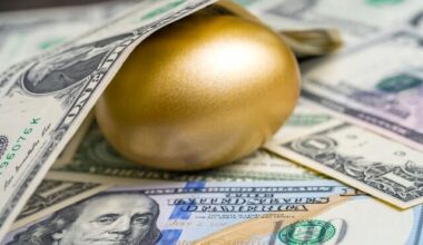 Golden egg on top of a spread of cash with a $1 bill covering the top of it