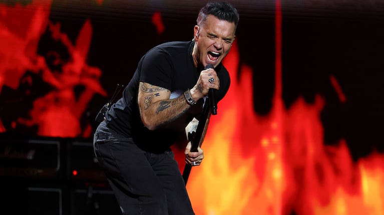 Robbie Williams performs on stage in tribute to Ozzy Osbourne during The BRIT Awards 2026 