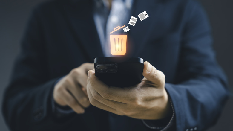 phone with a graphic depicting app uninstallation on top