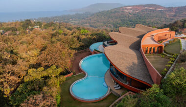 sanjay puri architects shapes 'crest nine' with a parabolic rooftop above the arabian sea