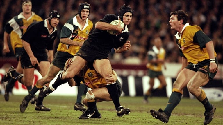 Scott Mcleod runs into the Wallabies at the MCG in 1998.