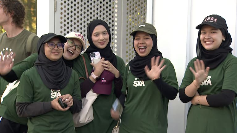 Smiling students help to transform Christchurch's red zone into lush forest.