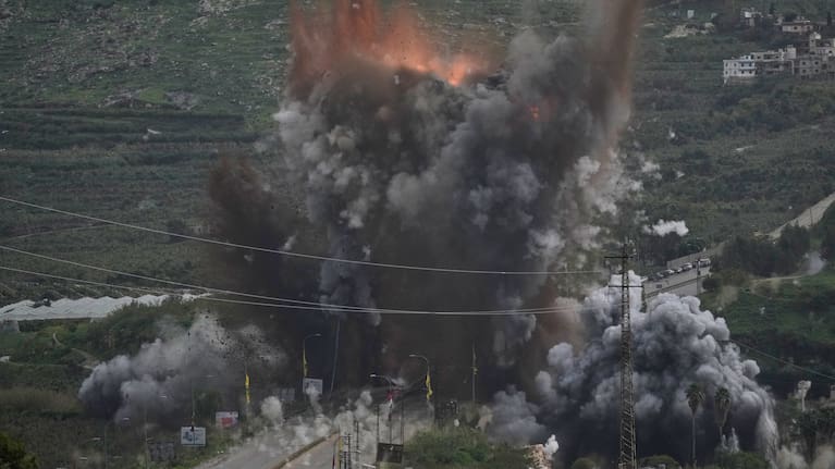 Smoke and flames rise from an Israeli airstrike that hit the Qasmiyeh Bridge near the coastal city of Tyre, Lebanon.