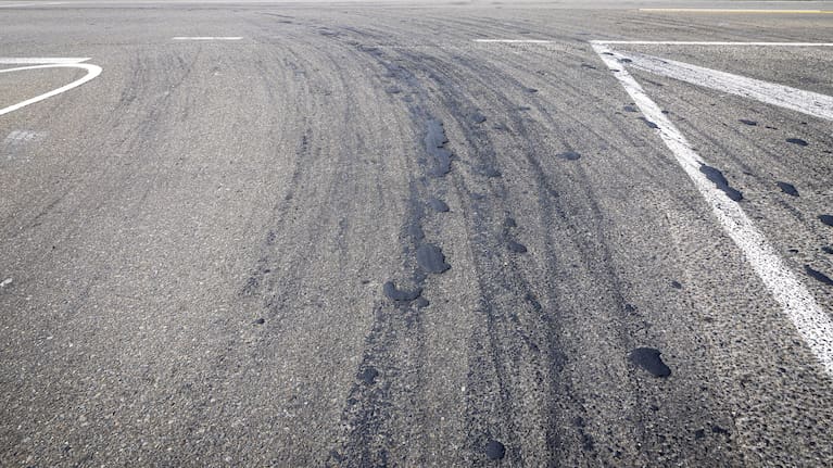 Some bitumen has been pushed into roads, but concentrated clumps remain as shown on El Prado Dr in Palmerston North, a busy route for many transport companies. (Source: Supplied / Adele Rycroft)