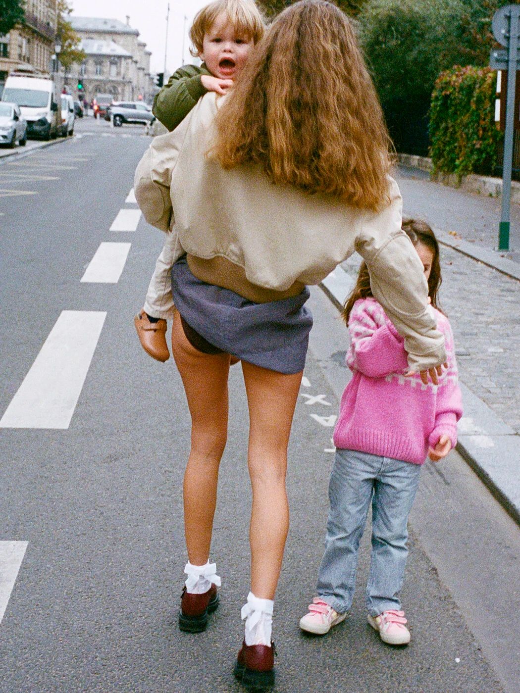 Image may contain La Parka Clothing Shorts City Road Street Urban Child Person Pants Baby Brown Hair and Hair