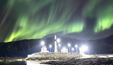 Rocket shines under the northern lights photo of the day for March 25, 2026