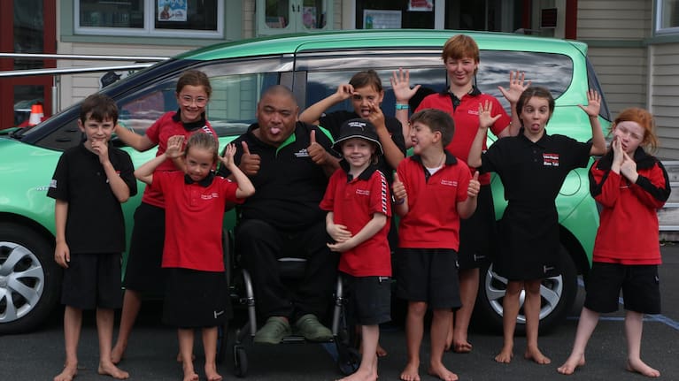 Terry Faleva’ai pictured with some of his students as part of the Kiwi Can programme.