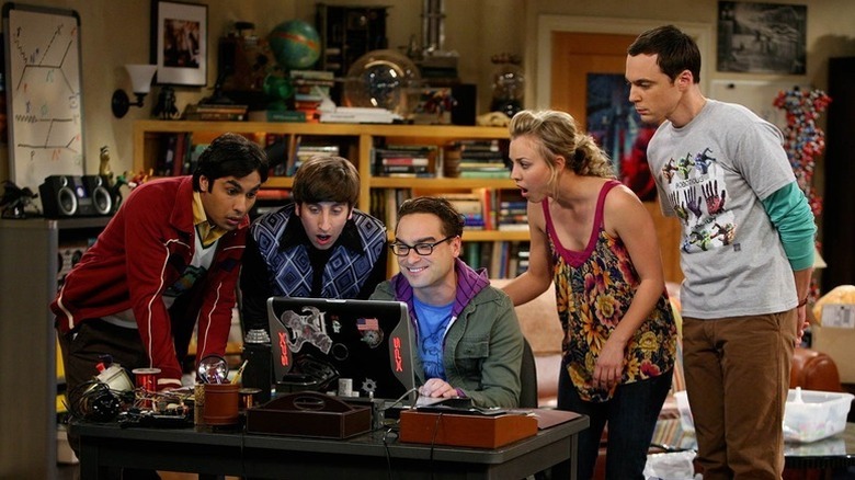 Raj Howard Leonard Penny and Sheldon looking at a laptop on The Big Bang Theory