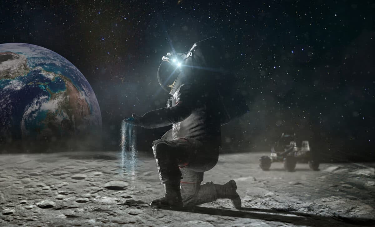 The Astronaut Sits On His Knee On The Lunar Surface And Pinches The Ground