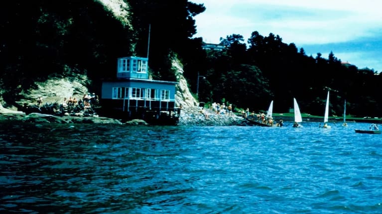 The original Blockhouse Bay Yacht Club on Te Whau Point, Blockhouse Bay Beach, in 1956. Photo: Supplied / Blockhouse Bay Historical Society Bill Glen Collection
