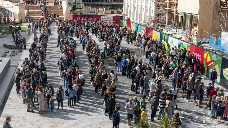 The queue to get back into Wellington Central Library reaches around the also re-opened Civic Square, past ongoing work at the town hall.