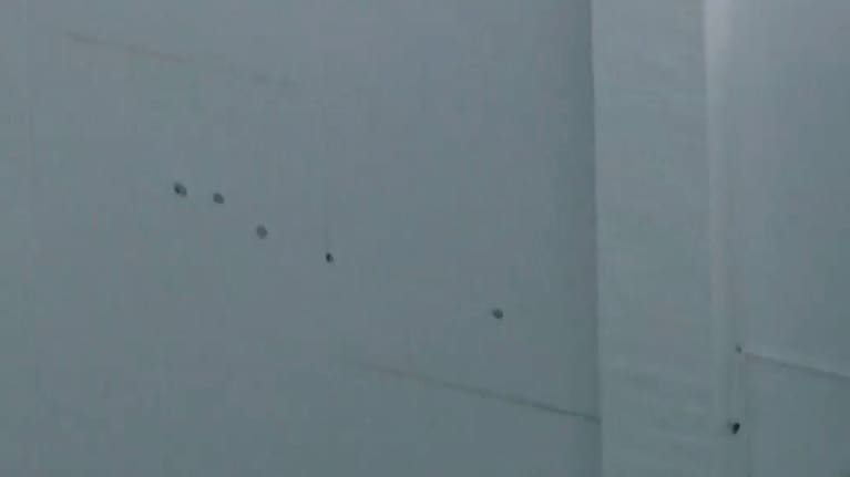 This image taken from video provided by ABC7 Los Angeles on Monday, March 9, 2026 shows what appears to be bullet holes on a wall at singer Rihanna's home in Los Angeles.