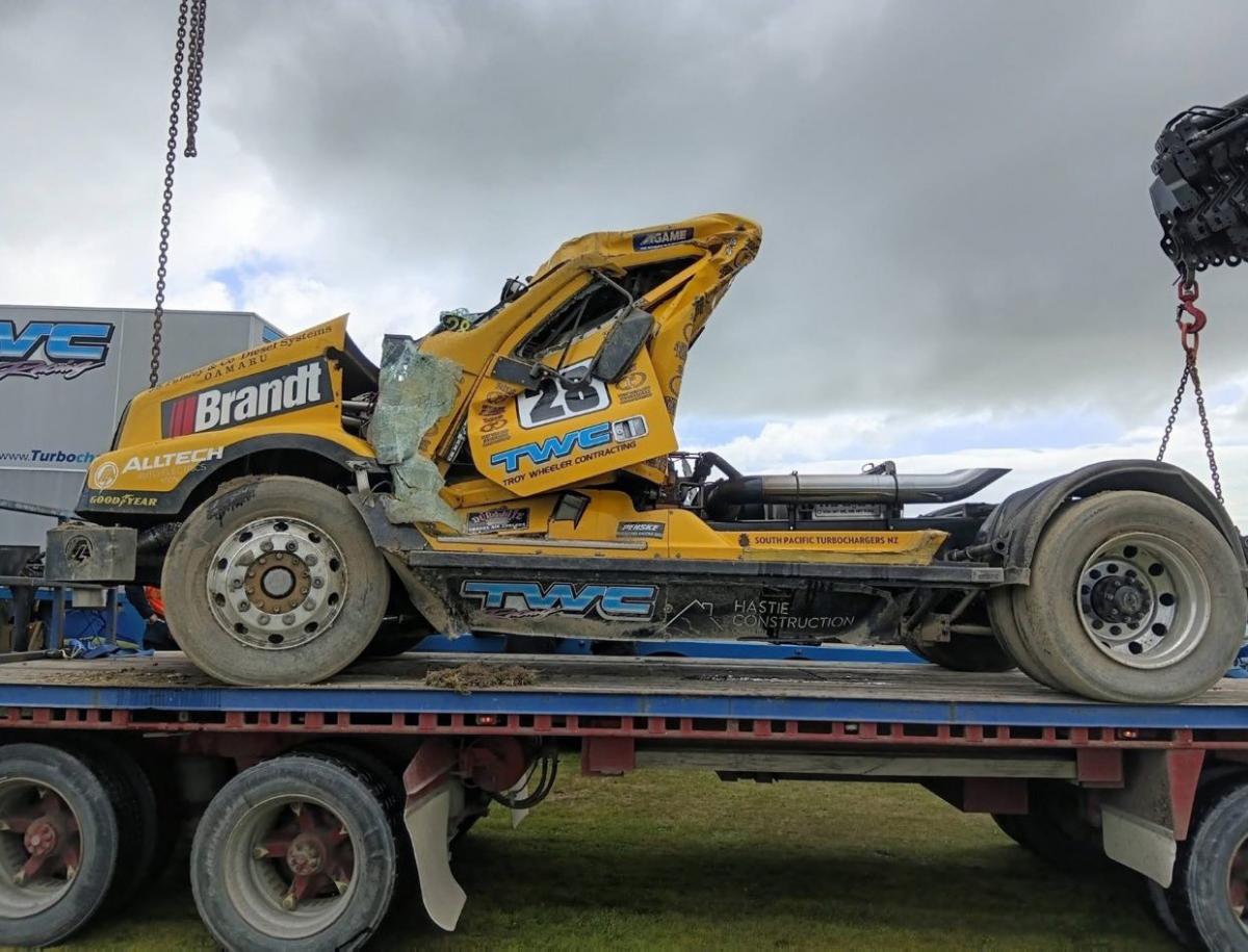 Driver cut from rolled-over racing truck