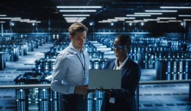 Two engineers overlooking an AI data center.