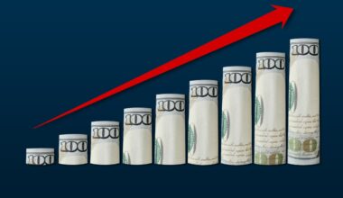 A rising red arrow next to a rising chart made from $100 bills.