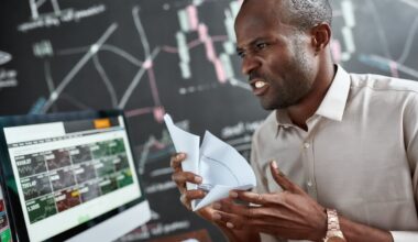 An angry trader balling up some paper.