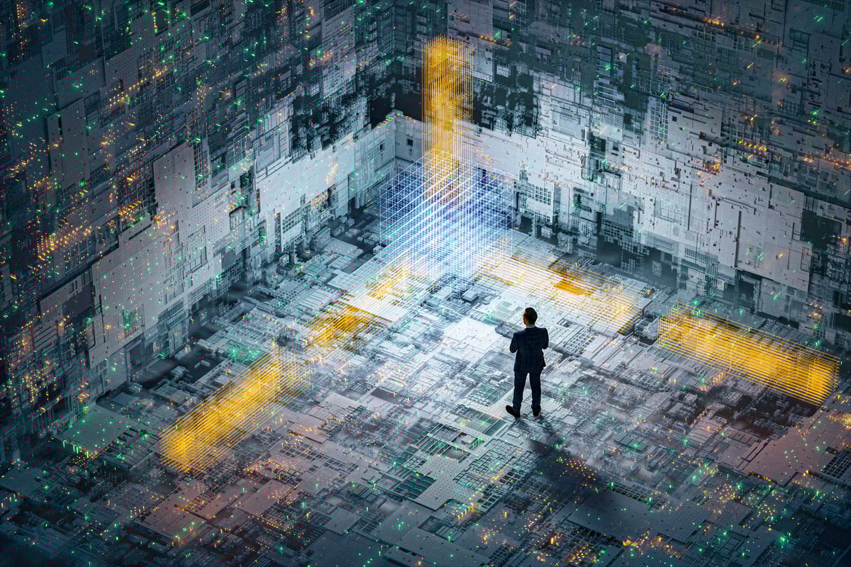 An investor in a suit is standing inside a massive enclosure of computer and networking equipment, illustrating the growing importance of artificial intelligence (AI) stocks.